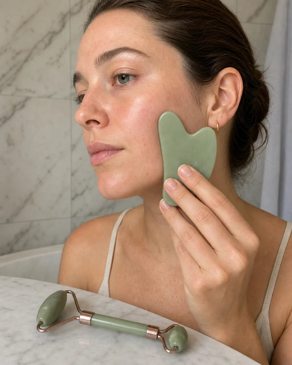 Single decisive beauty-use photograph for a 4:5 vertical process panel, showing one realistic hand g